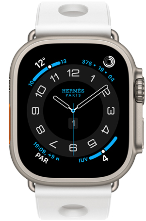 Apple Watch Hermes Ultra 3, bo?tier en titane, naturel, cadran Hermes Circulaire, complications : météo, anneaux d’activité, heure de Paris, indice UV, bracelet Scub’H Diving, blanc