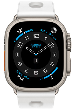 Apple Watch Hermès Ultra 3, bo?tier en titane, naturel, cadran Hermès Circulaire, complications : météo, anneaux Activité, heure de Paris, index UV, bracelet Scub’H Diving, blanc