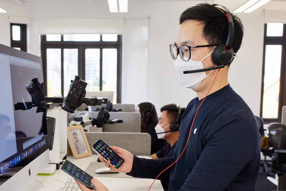 An Apple online team member at the call centre in Shanghai advises a customer on the new iPhone 12 models. 