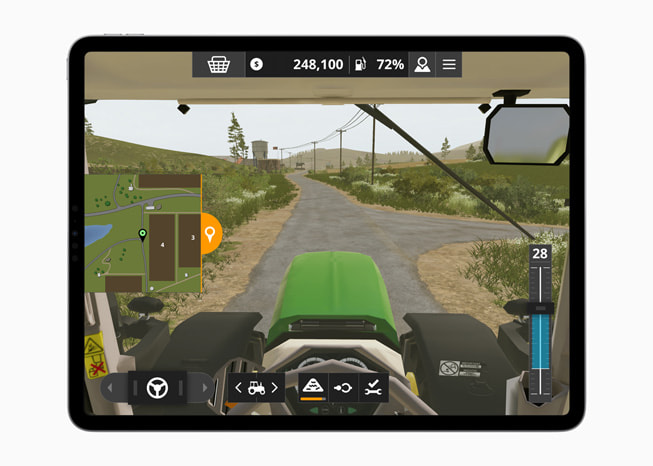 iPad Pro’da, Farming Simulator 20+ oyununda bir ?iftlikteki trakt?rü g?steren bir g?rüntü.