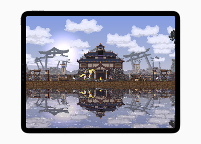 iPad Pro’da, Kingdom Two Crowns oyununda su kenar?ndaki bir evi g?steren bir g?rüntü.