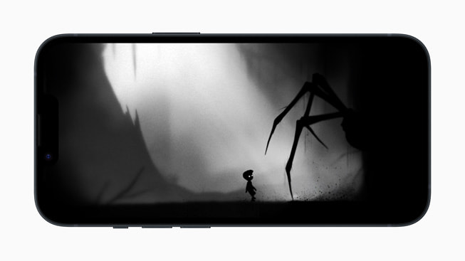 iPhone 14’te, Playdead’in LIMBO+ oyununda g?lgeler i?inden kü?ük bir ?ocu?a yakla?an dev ?rümce?i g?steren bir g?rüntü.