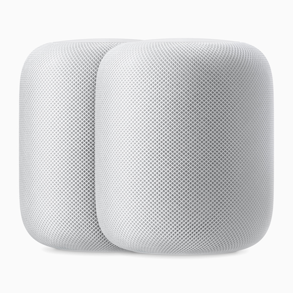 Two white HomePod speakers.