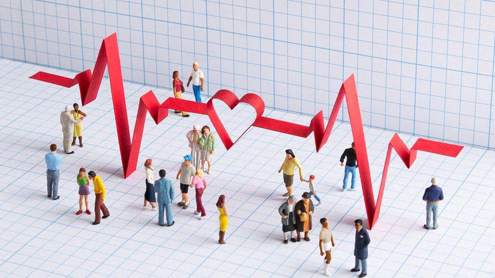Büyük bir EKG sinyali grafi?iyle ?evrelenmi? ki?ileri üstten g?steren resim. 
