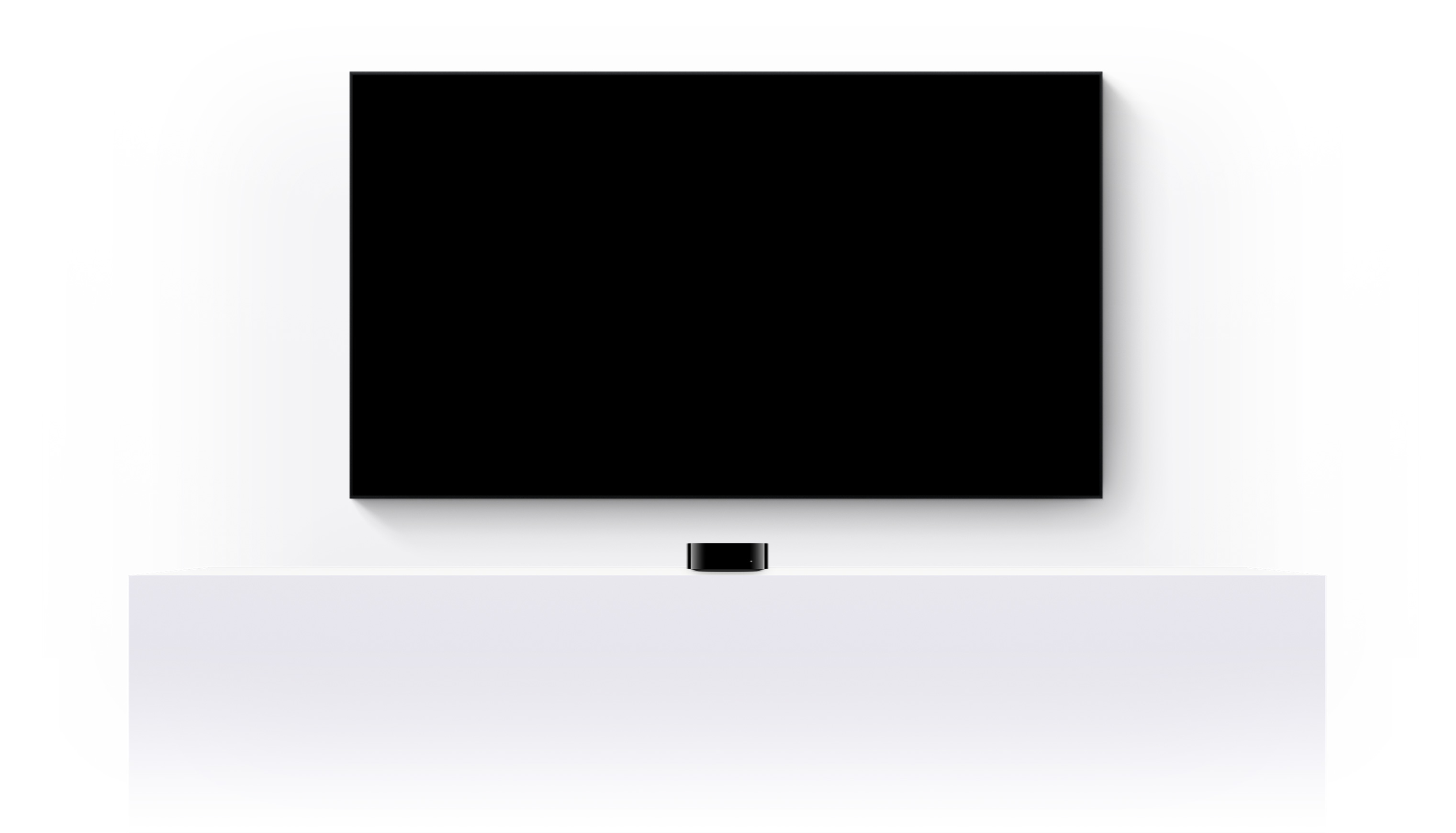 Apple TV 4k i telewizor p?askoekranowy, na którym wy?wietla si? zwiastun zmontowany z fragmentów ró?nych filmów i seriali Apple TV+