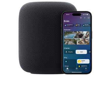 Gece Yar?s? renginde bir HomePod ile ekran?nda Ev uygulamas?n?n 'Evim' arayüzü g?rülen bir iPhone g?steriliyor