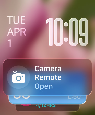 El widget de Control de Cámara aparece en la parte inferior de la pantalla, con números translúcidos en la parte superior derecha y la fecha a la izquierda
